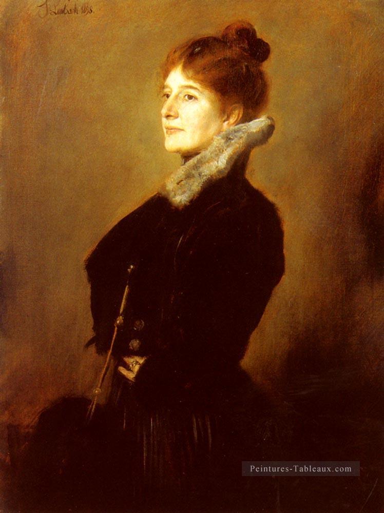 Portrait d’une femme portant un manteau noir avec un col en fourrure Franz von Lenbach Peintures à l'huile